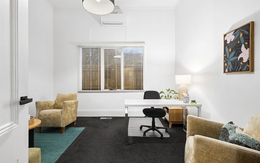 Assessment reports and notebook in a calm consultation space